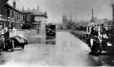 Flooding at Beighton, Crown Terrace, Rotherham Road, note old coke plant and pit in background