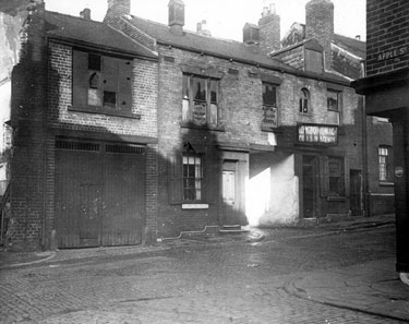 Rowland Street at junction with Apple Street, showing gable of No. 15, Rowland Street, where it adjoins the premises of Messrs. Longbottom and Co., Colliery Agents