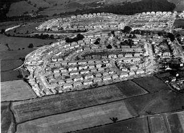 Aerial view -  Shiregreen Estate under construction showing roads including Shirehall Road, Shirehall Crescent (bottom of picture), Wood Road and Sycamore House Road (top of picture) with Woolley Wood (top of picture)