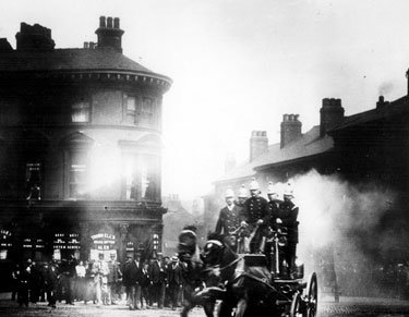 Fire engine passing George and Dragon public house, Nos. 94 - 96 West Bar, at the junction of Corporation Street (former Gaiety Theatre)