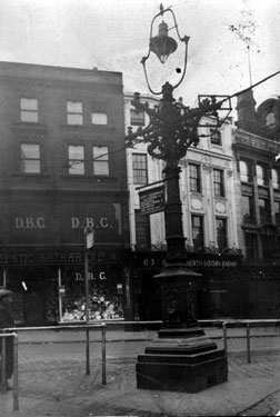 Lamp post on Market Place/Angel Street, showing No. 61 Domestic Bazaar Co. Ltd., No. 63 L.N.E.R. and No. 63 H. L. Brown and Son Ltd., Market Place