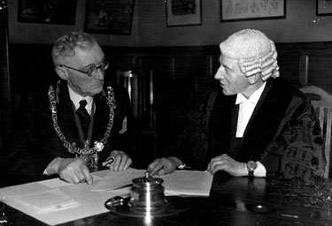 City Council in session, Lord Mayor, Ernest Storm Graham and Mr John Heys, town clerk, glance at the agenda before going into the meeting