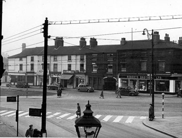 Premises on Button Lane from Furnival Street, Moorhead, centre, The Moor, left, (foreground), No 2, Moorhead, Roberts Brothers Ltd., general drapers, Nos. 18-22 Button Lane, Angel Inn, No. 24 Evans and Green, confectioners, No. 26 Skidmores, butchers
