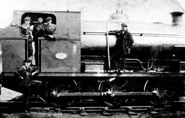 T.R.G. Peckett O-6-0 Saddle Tank Steam Locomotive, Brookhouse Colliery, Sheffield Coal Company, showing Harrison Boulton (centre of footplate), Ted Willamson, driver (right of three men), Roland Payne, locomotive fitter (below footplate))