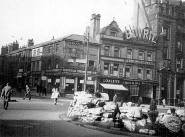 Town Hall Square and Fargate looking towards Leopold Street, including No. 70 Sheffield Creameries Ltd. (corner of Leopold Street) and No. 68 Loxley Brothers Ltd., printers, No. 66 Fleur de Lis public house, (Bovril sign)