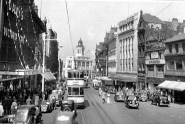 Fargate looking towards High Street including Nos. 38-40 Arthur Davy and Sons, provision dealers and Victoria Cafe, left, Nos. 33-35 James Woodhouse and Son, house furnishers, Nos. 41-43 W.P. Kenyon, estate agents, right