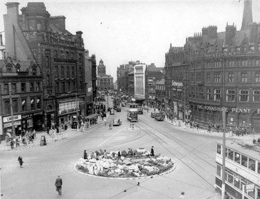 Elevated view of Town Hall Square looking towards Fargate, Town Hall Square rockery, foreground, No. 66 Fleur de Lys public house and Bank Chambers, left, Carmel House, Albany Hotel and Yorkshire Penny Bank, right