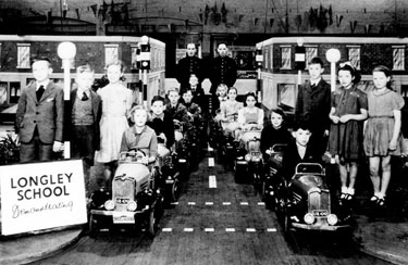 Longley School Children at the Road Safety Exhibition at Edmund Road Drill Hall, Pc Marshall on the right