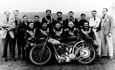 The Sheffield Tigers Speedway Team, 1940, Owlerton, captain of the team Frank Vary on extreme left wearing check jacket. Electric Power Station Cooling Tower right hand edge