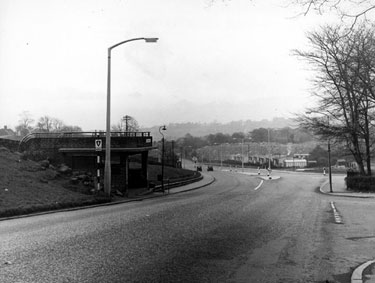 Looking South East along Herries Road at junction Norwood Road showing the bus stop near the entrance to City General Hospital (later Northern General) and prefab housing on the right