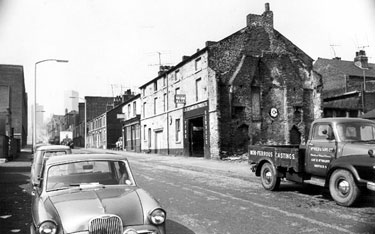 Hoyle Street looking towards Malinda Street and St. Anne's Church showing C.H. Richardson (Tyres) Ltd, tyre distributor and No.40, Talbot Inn
