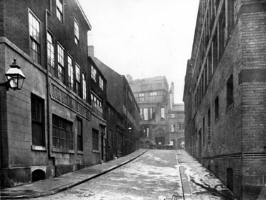 Milk Street from Sycamore Street looking towards Norfolk Street, No 10, John Biggin Ltd., silver manufacturers, left, works belonging to Joseph Rodgers and Sons Ltd., Cutlery Manufacturers, right 	