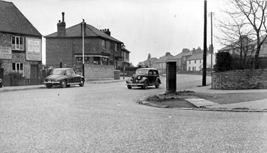 Norton Lees Lane, at junction with Derbyshire Lane, after removal of police box, Nos. 9 - 11 Frank Clover and Sons Ltd., builders and No. 17 Thos. R. Outram, grocer