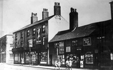 Nos. 63 - 73 Pond Street, later became site of bus station, premises include Nos. 71 and 73 Ann E. Fallas, shopkeeper, entrance to Court 5, No. 67 Dining Rooms, No. 65 George Binns, hairdresser
