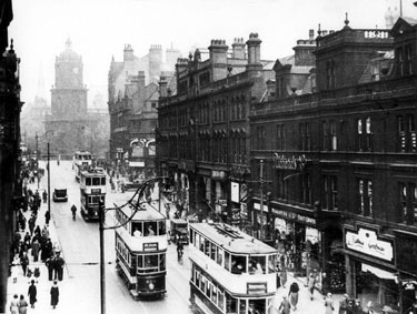 General view of Pinstone Street, premises on right include Empire Buildings, Nos 129-131, Richards and Co., Fancy Drapers, No 135, Barney Goodman, Tailor and Cambridge Arcade