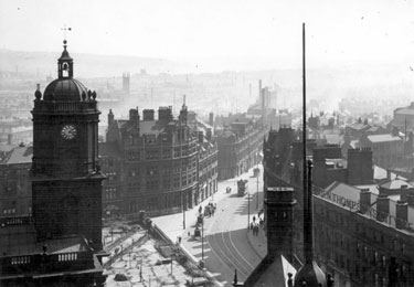 Elevated view of Pinstone Street, from the top of the Town Hall Tower, St. Paul's Church, left, Prudential Buildings, centre 	