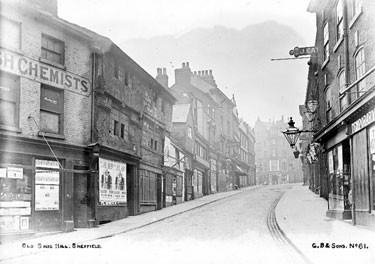 Snig Hill from West Bar, derelict timber framed shops, prior to demolition in 1900, left, premises on right include No 53, John Eaton, pawnbroker