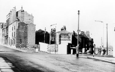 Snig Hill at junction with Bank Street, left, showing partial demolition of the Black Swan Hotel after the Blitz