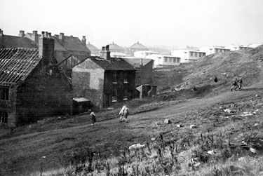 Nos. 4 and 5, Owlet Lane (off Upwell Street) and children on footpath up Wincobank Hill, showing prefabs on Wensley Street and rear of property on Upwell Street