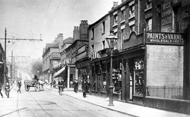West Street, looking towards Glossop Road, from outside No. 240 Beehive Hotel. Shops include No. 256 Glossop Road, Robert Cross, butcher