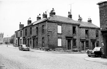 Derelict houses, William Street at junction with Hodgson Street. St. Silas C. of E. Church in background