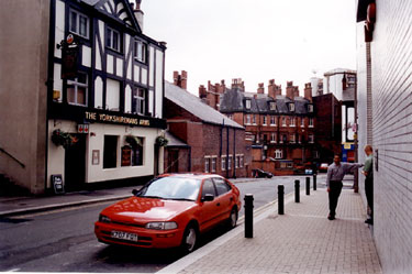 Burgess Street looking towards Cross Burgess Street. Premises on left include The Yorkshireman's Arms, No 31, Burgess Street and side view of Salvation Army Citadel