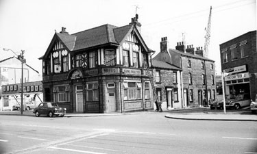 Dial Motors and Motormyles, car dealers and the Ship Inn, No. 312 Shalesmoor showing terraced housing on Dunfields