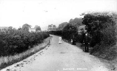 Looking west along Manchester Road towards Midhopestones crossroads, the building on the left is the house of Dawson the wheelwright on the right is Lower Hand Bank Farm, formerly the Rose and Crown public house