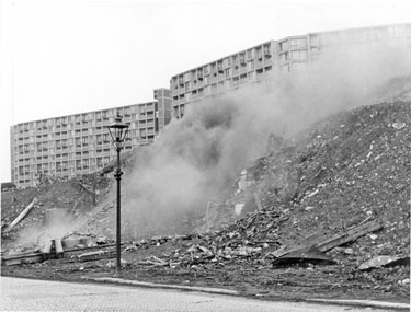 Demolition by J. Childs of a stable, Bungay Lane, Park Hill Flats open spaces with Park Hill Flats in the background