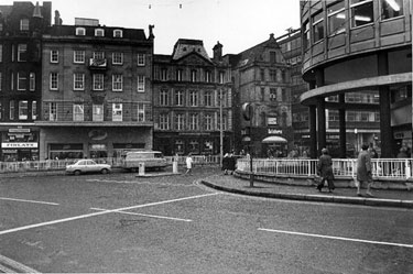 Coles Corner at the junction of High Street, Fargate and Church Street showing Finlay and Co. Ltd., tobacconists; Boots the Chemist; Barclays Bank (all High Street) and Salisburys Handbags Ltd., travel goods dealers (Fargate)
