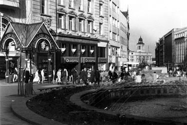 The Goodwin Fountain, entrance to Orchard Square and No. 58 Dixons Ltd., photographical equipment; audiovisual and  electronics store, Fargate looking towards Kemsley House, High Street