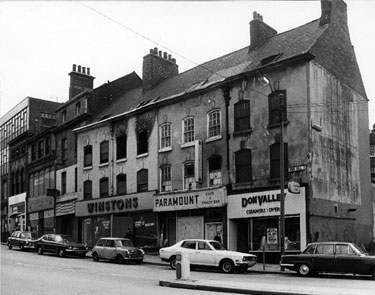 Derelict Nos. 61, Don Valley Cleaners Ltd., 59, Paramount Cafe; 55 - 57, Winstons (Sheffield) Ltd., outfitters; 53; 49 - 51, Sugarman Brothers Ltd., house furnishers and 47, Domestic Electric Rentals (DER), Snig Hill