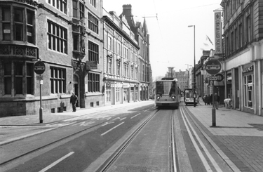 Supertram No. 08 travelling up Church Street with Cairns Chambers: Lloyds Bank Chambers; the Gladstone Buildings (left) and the entrance to Orchard Square (right) 