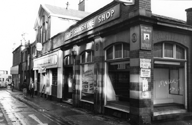 Derelict former premises of Sunshine Food Store Ltd., The Sunshine Shop and Berni Inn Steak House, Orchard Street from the junction with Orchard Place looking towards Church Street showing the sign for The Stone House public house; 