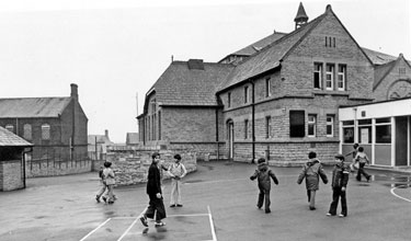 Huntsman's Gardens County School from the Bodmin Street side of playground  with the former Attercliffe Wesleyan Chapel Sunday School left