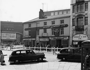 The Elephant Inn, Nos. 2 - 4, Norfolk Street and Nos. 18, G. E. Inman Ltd; 14 - 16, John Smiths Tadcaster Brewery Co. Ltd. office, 12, F. Corker and Son Ltd., fruitiers and The White  Building, Fitzalan Square and  Odeon Cinema