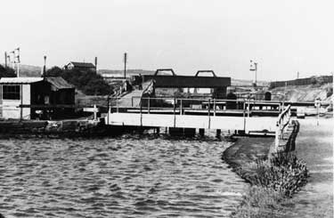 Footbridge over Sheffield and South Yorkshire Navigation at Tinsley Bottom Locks looking towards Railway Bridge and Signal Box
