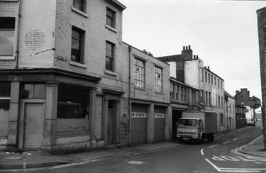 Nos. 61, Jim Storey, motor engineer and 69/71, Ellis Son and Paramore, surgical appliance manufacturers, Spring Street from No. 23 Corporation Street (derelict shop) looking towards Russell Street