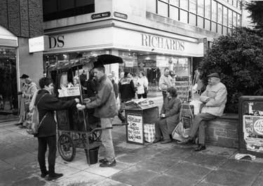 Newspaper and chestnut sellers outside Richard Shops Ltd., Fargate at junction with Chapel Walk
