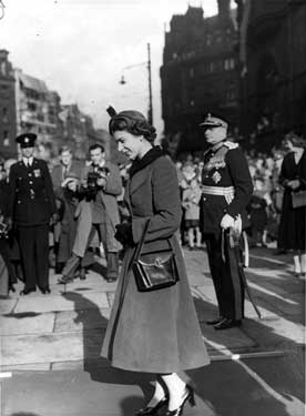 Queen Elizabeth II outside the Town Hall with Roger Lumley, 11th Earl of Scarborough, Lord Lieutenant of West Riding of Yorkshire in the back ground right