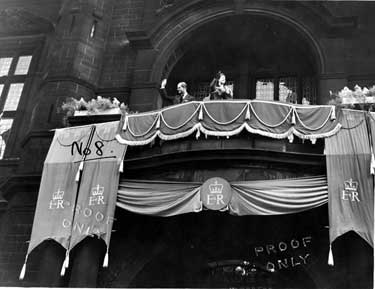 Queen Elizabeth II and HRH Duke of Edinburgh waving to the crowds from the balcony of the Town Hall, Pinstone Street