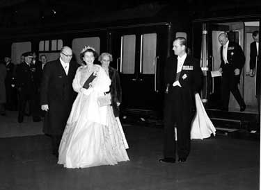 Queen Elizabeth II and HRH Duke of Edinburgh leaving the royal train at the Sheffield Midland railway station for an evening reception at the Cutlers Hall with Deputy Lord Mayor, Oliver S Holmes 