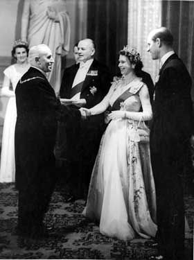 Queen Elizabeth II and HRH Duke of Edinburgh being greeted by The Master Cutler, W.G. Ibberson at the evening reception in the Cutlers Hall with Lord Lieutenant of the West Riding, Lord Scarborough in the background