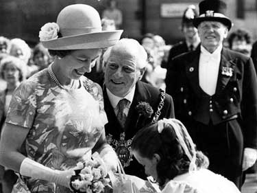 Queen Elizabeth II being presented with a bouquet by 11 year old Jane Richardson granddaughter of Lord Mayor, Albert Richardson