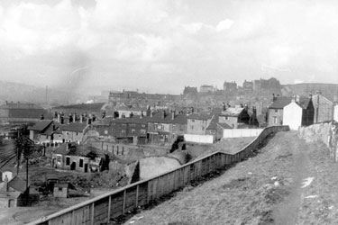 Oborne Street and playground (centre of picture) taken from opposite No. 52 Marcus Street with derelict building belonging to Bridgehouses Goods Station in the left foreground