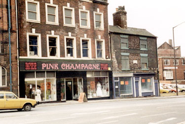 Nos. 52 - 62 West Bar. Building on the left was Britannia Theatre, then occupied by Pink Champagne. Nos. 60 and 62 (on right), former house with datestone 1794. It was formerly occupied by J.T. Dobb and Son Ltd., paint manufacturer