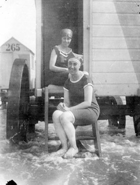 Ida Stringfellow (in doorway) and friend at Scarborough or Cleethorpes, with bathing machine
