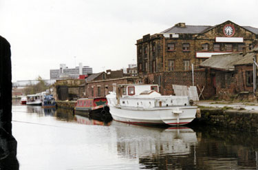 Various water transport moored near the derelict Sheaf Works on the SYK Navigation