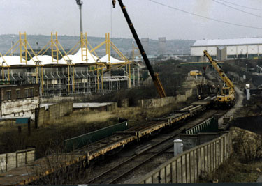 Laying Supertram tracks on the bridge over Worksop Road with Don Valley Stadium (left) and Sheffield Arena (right) in the background