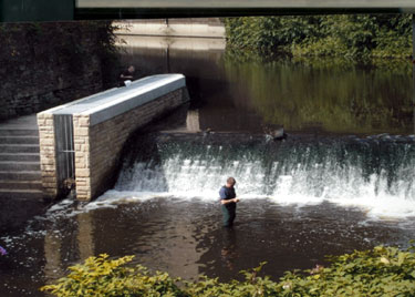 Fishing at Walk Mill Weir, River Don showing the fish ladder